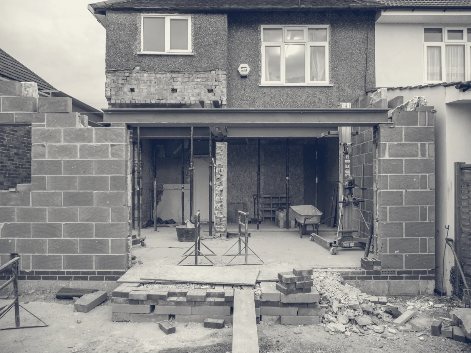 A single-storey rear extension under construction with a steel beam in place